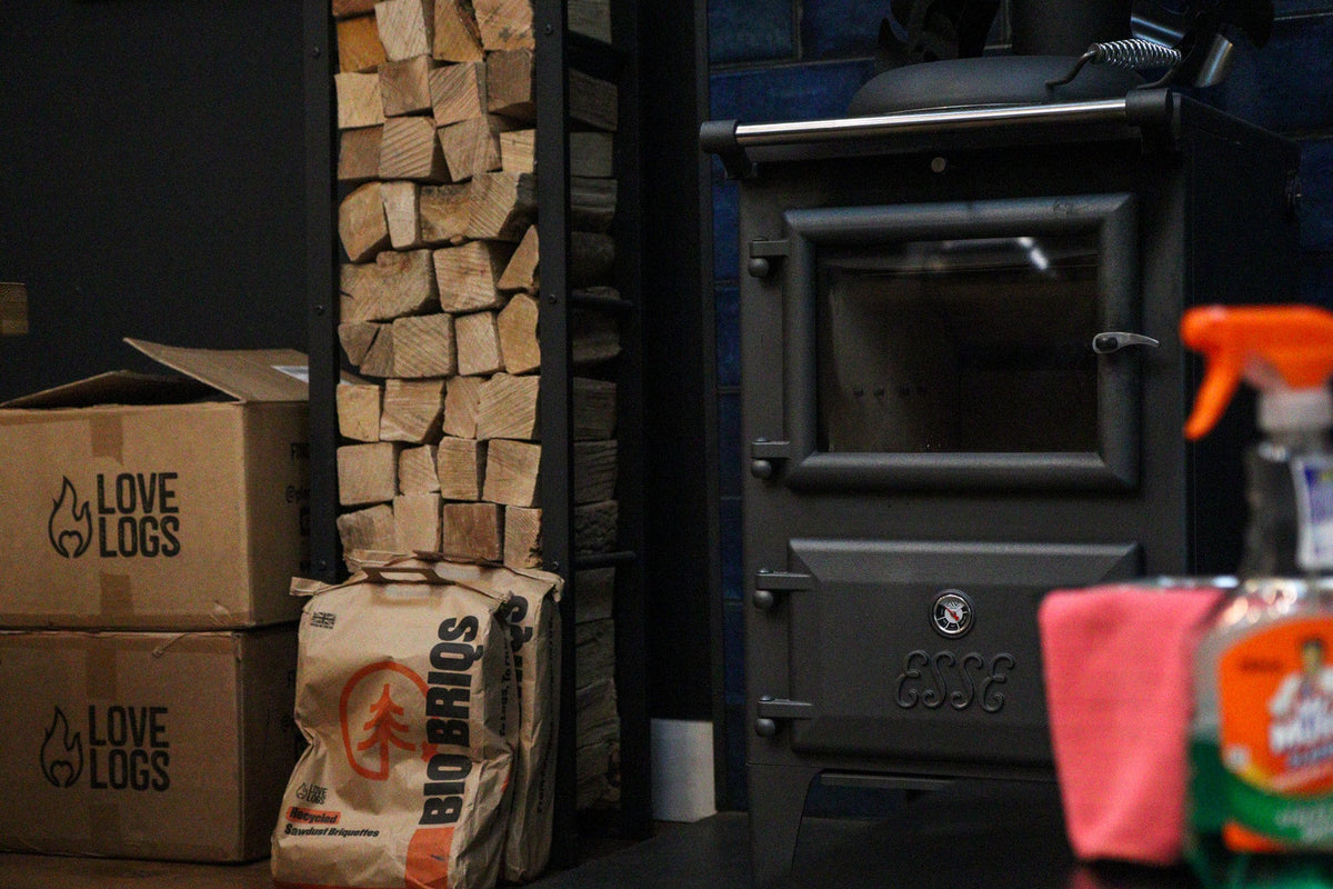 Log burner with logs and cleaning equipment