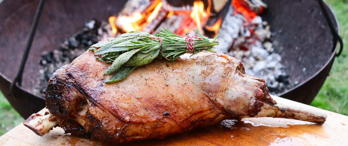 A leg of lamb cooked over live fire