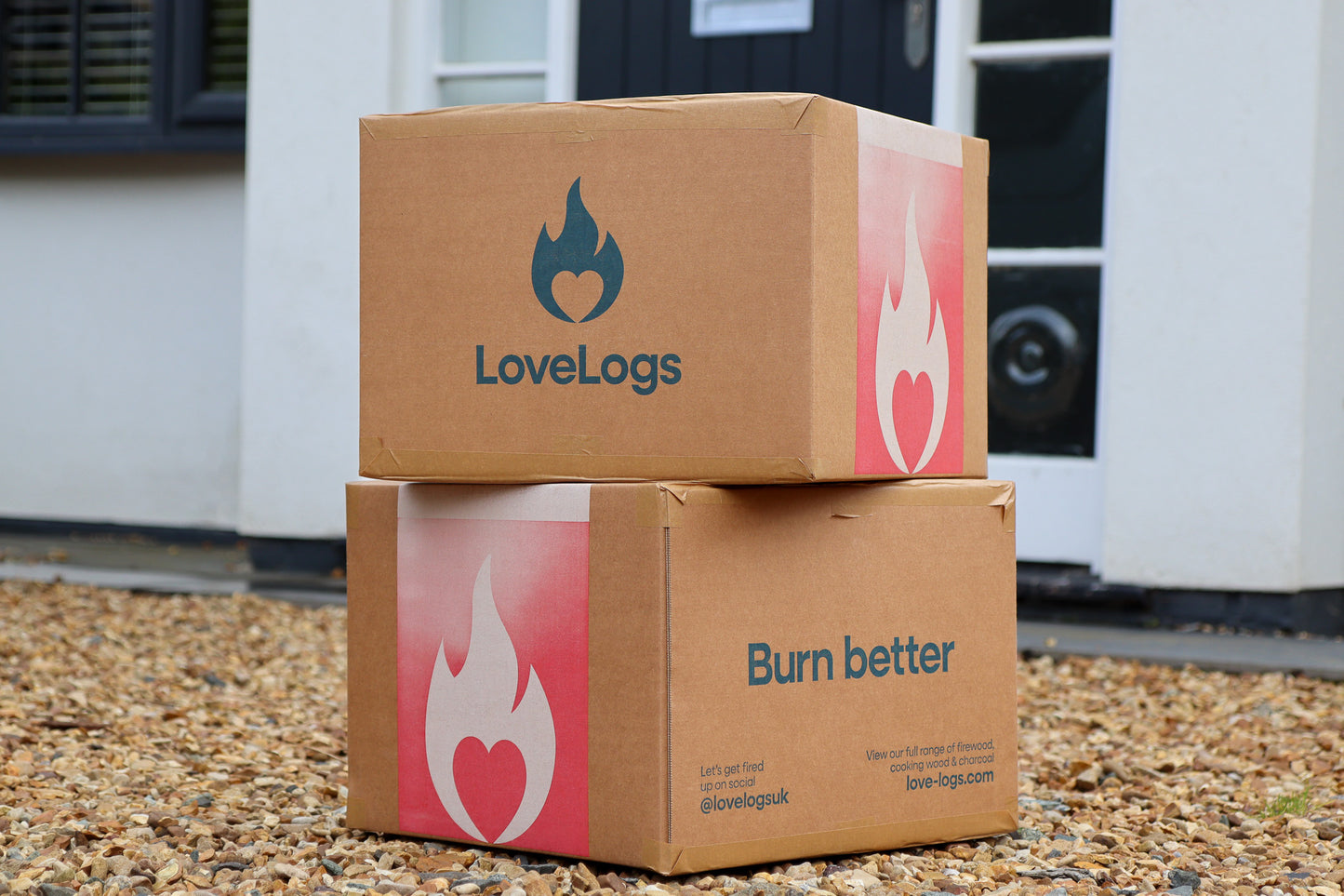 Boxes of Love Logs on Driveway