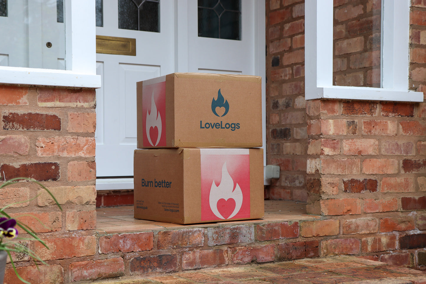 Boxes of Love Logs on Porch Step