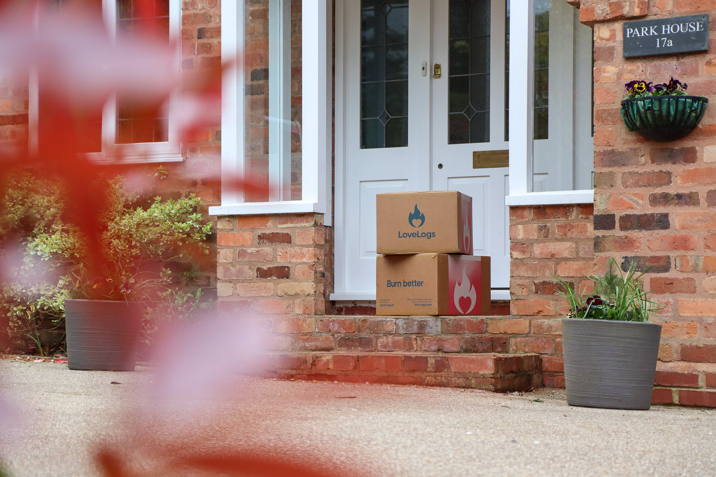 Boxes of Love Logs on Porch Step