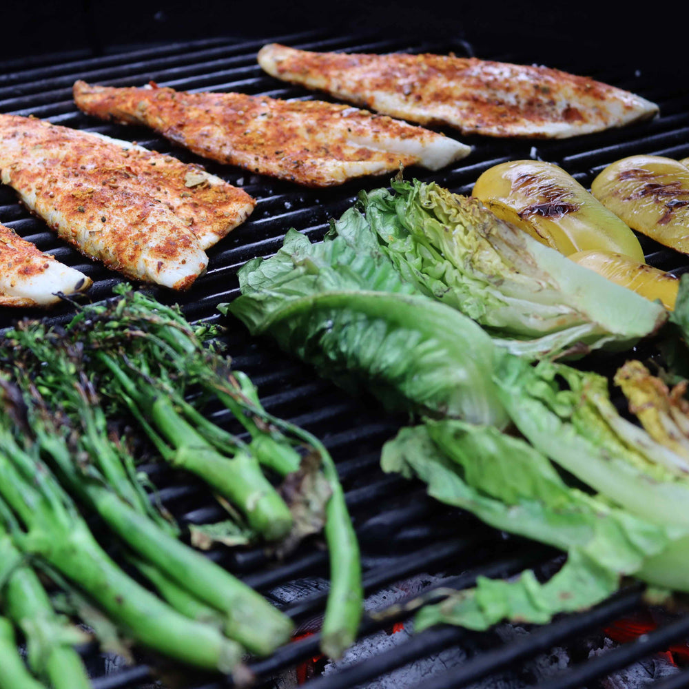 
                      
                        Chicken breasts, peppers and broccoli being grilled on the BBQ over Love Logs Sustainable British Charcoal
                      
                    