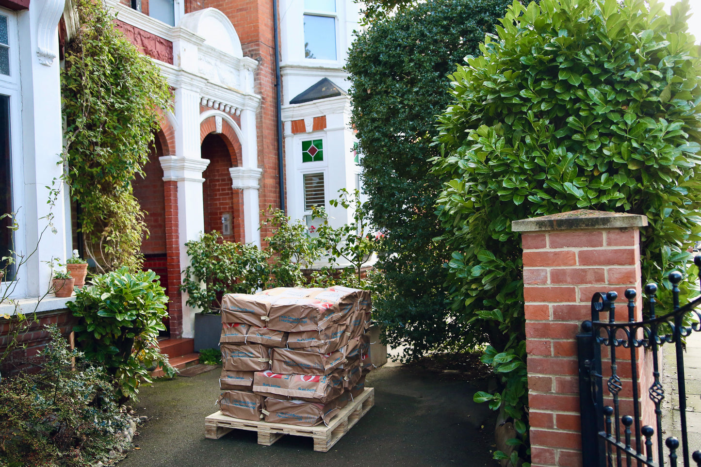 Half pallet of Ready to Burn logs on a driveway