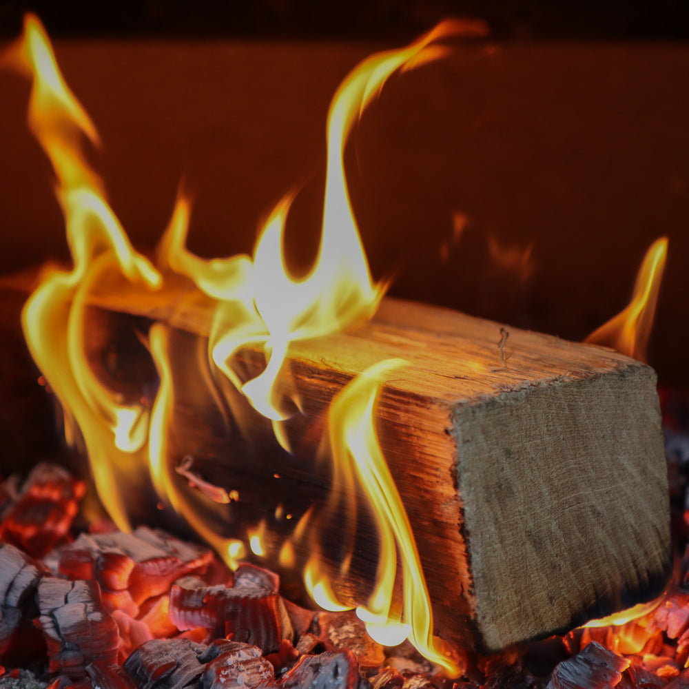
                      
                        Oak log burning in log burner
                      
                    