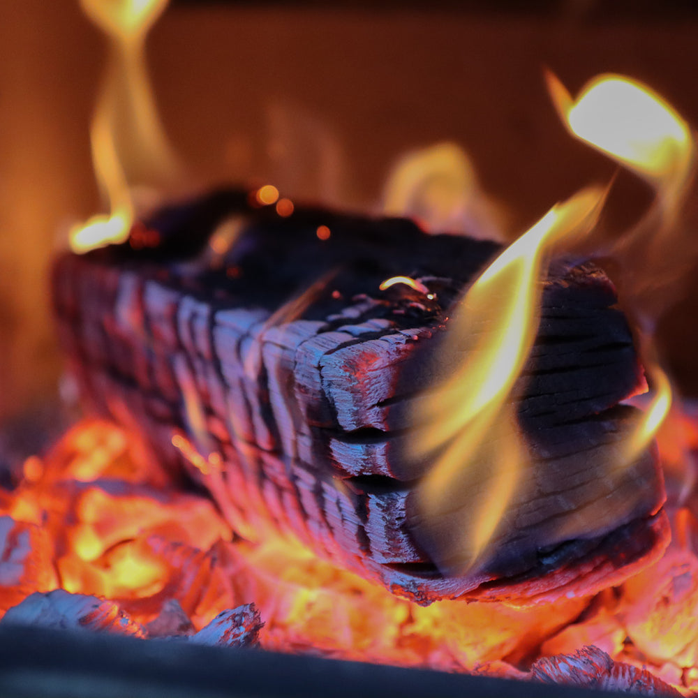 
                      
                        Oak log burning in log burner
                      
                    