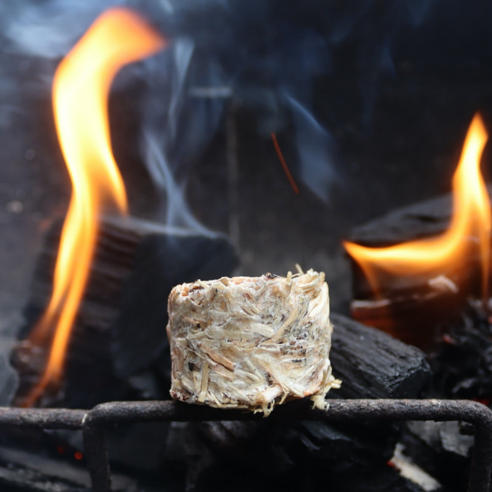 
                      
                        A natural firelighter next to burning charcoal
                      
                    