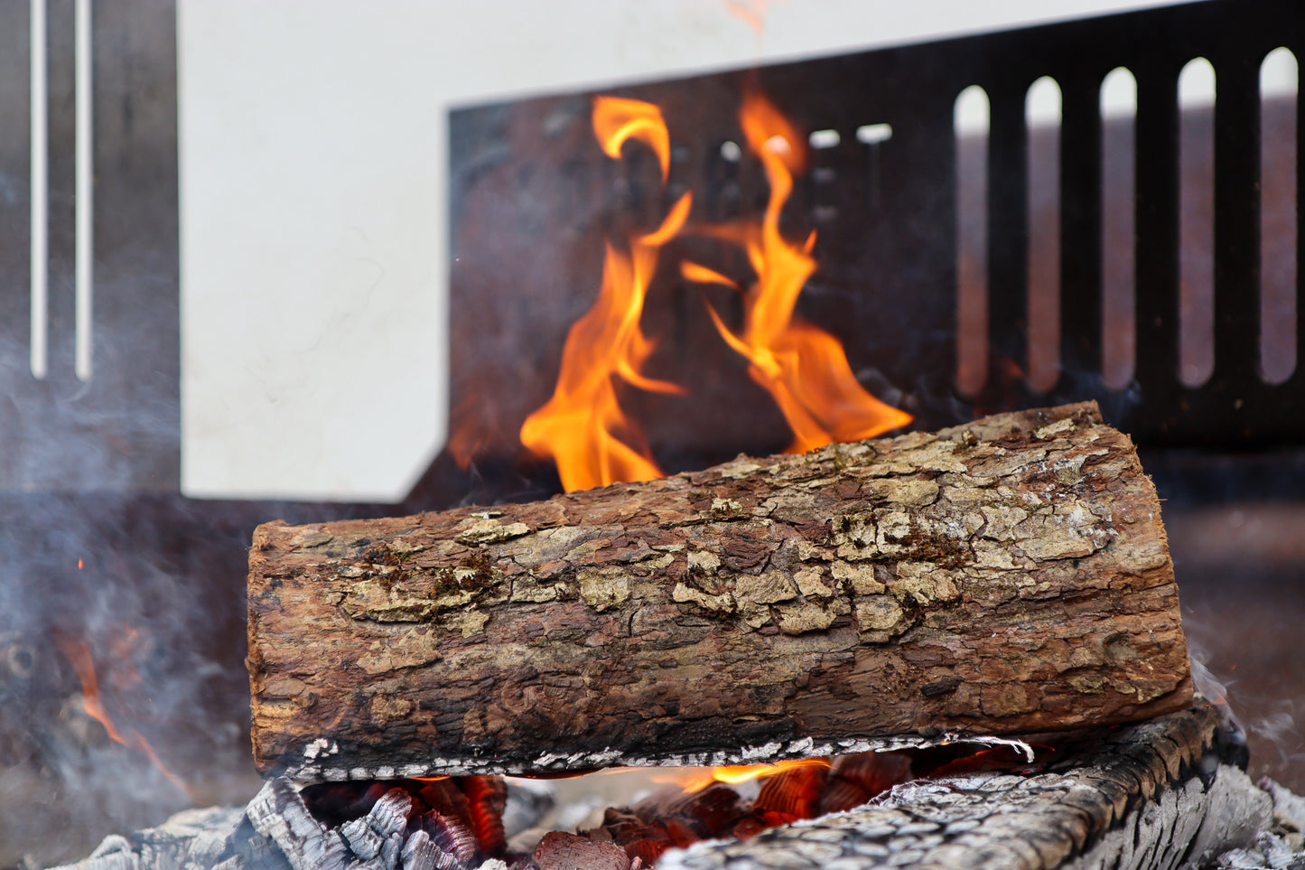 Love Logs Apple Log Burning on Asado BBQ