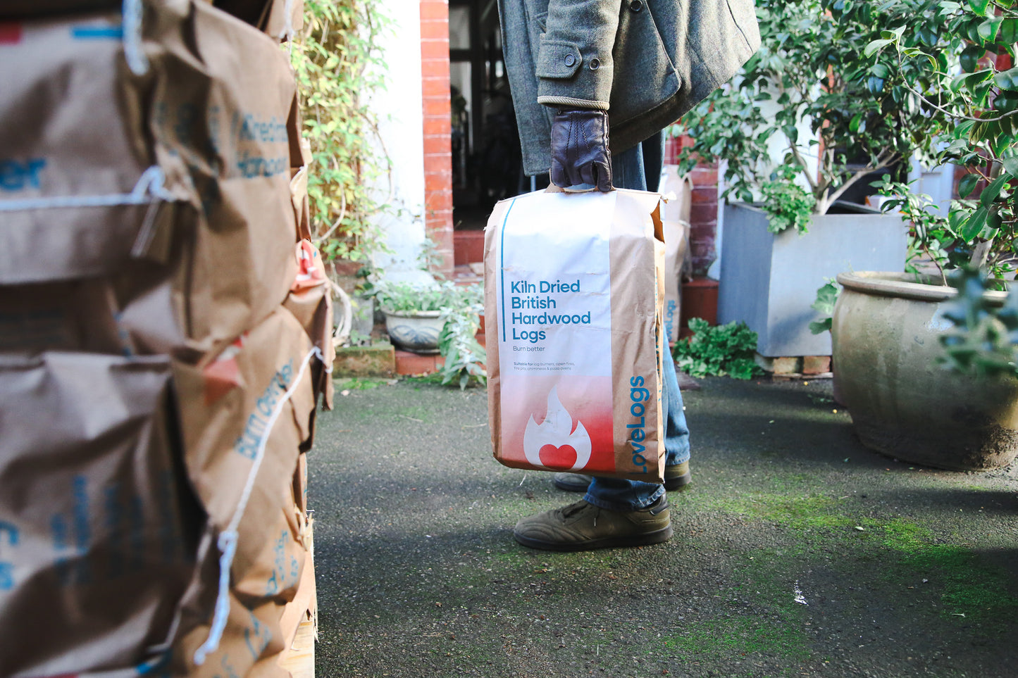 Unloading pallet of logs on driveway
