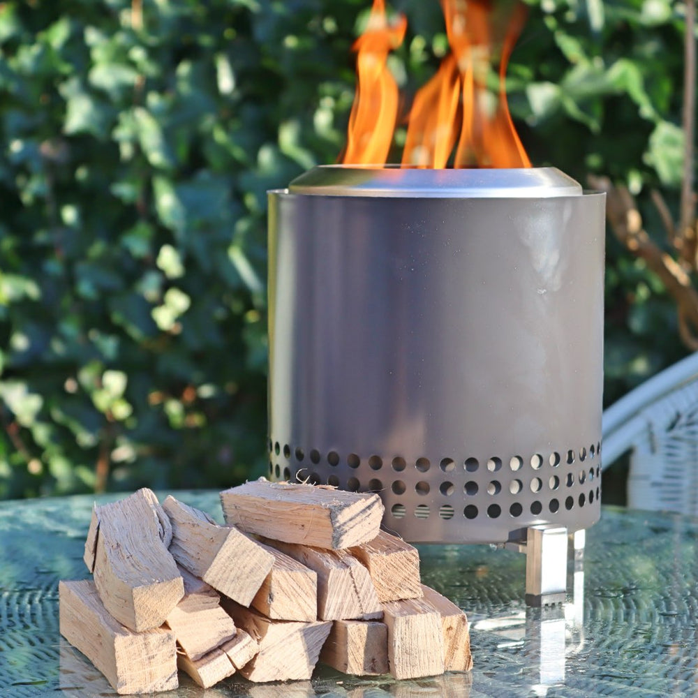 Love Logs Mini Fire Pit Wood next to Mesa XL