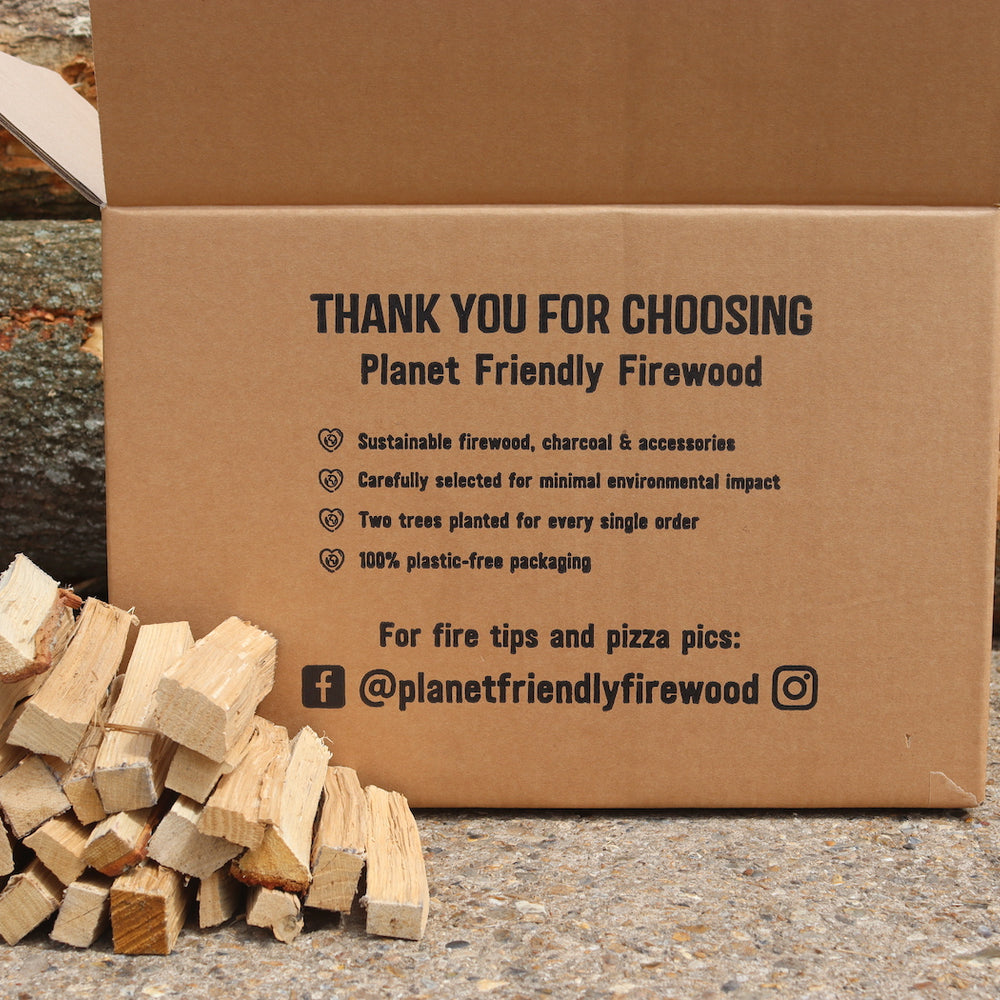 
                      
                        Oak hardwood kindling for pizza ovens shown boxed in plastic free packaging in front of timber
                      
                    